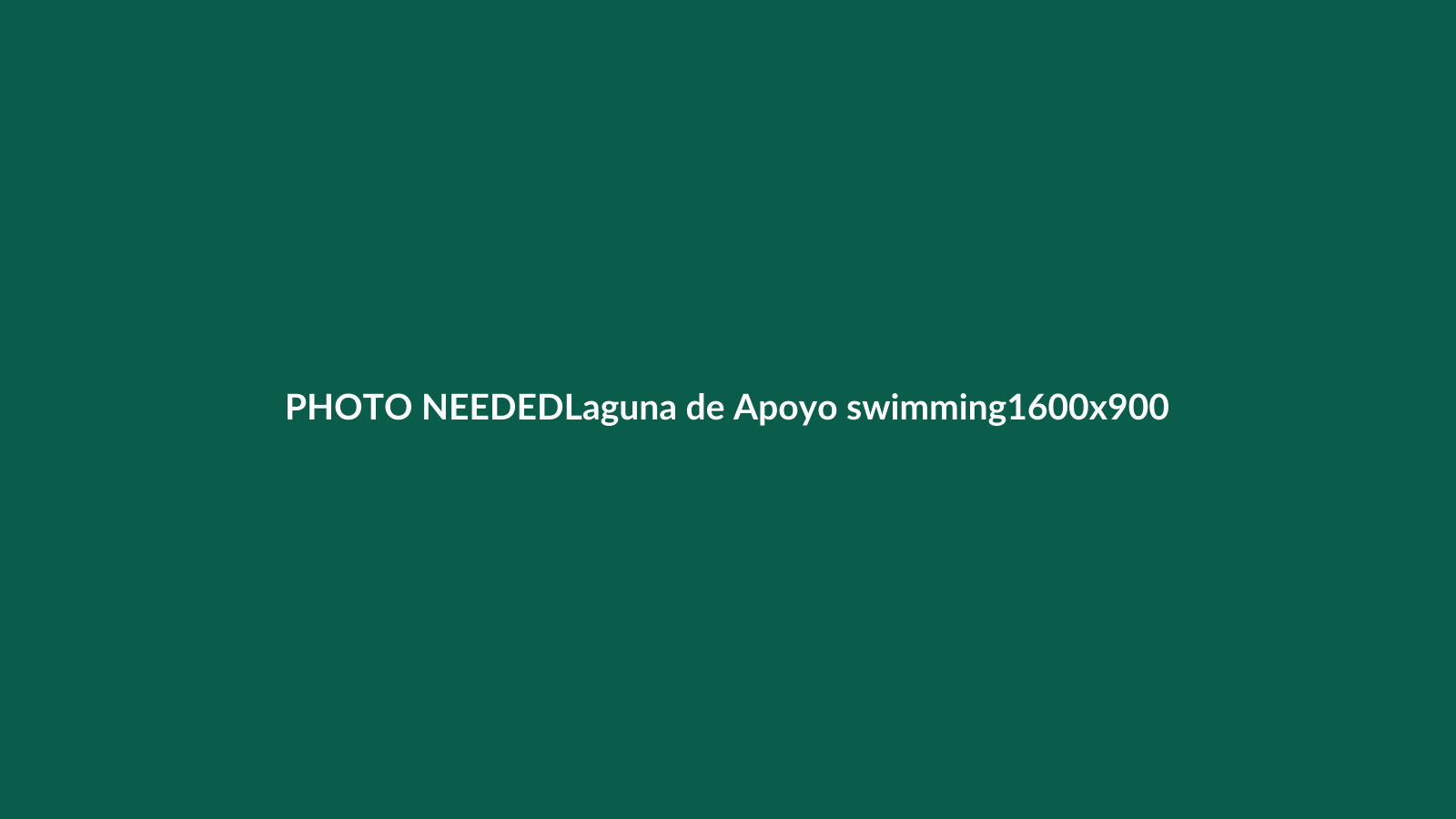 Calm water and crater walls at Laguna de Apoyo, Nicaragua