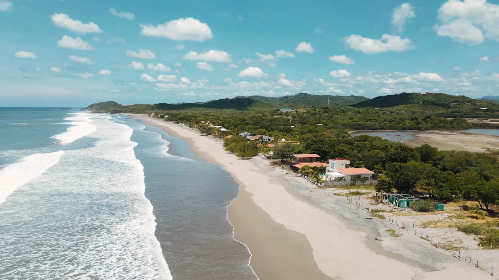 Long sandy beach and gentle waves at Playa Guasacate, next to Popoyo, Nicaragua