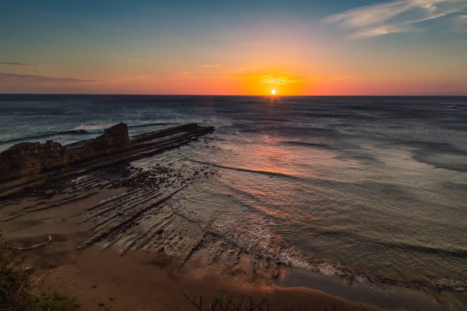 Sunset over the reef and ocean at Beginners Bay, Popoyo, Nicaragua